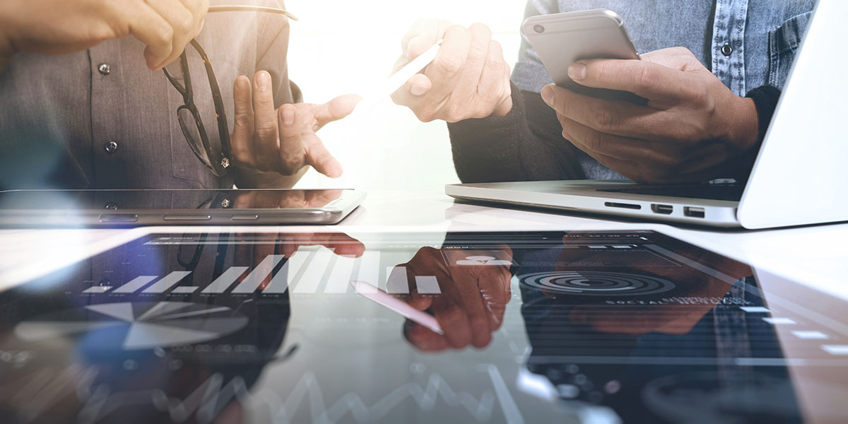 two people working on computers