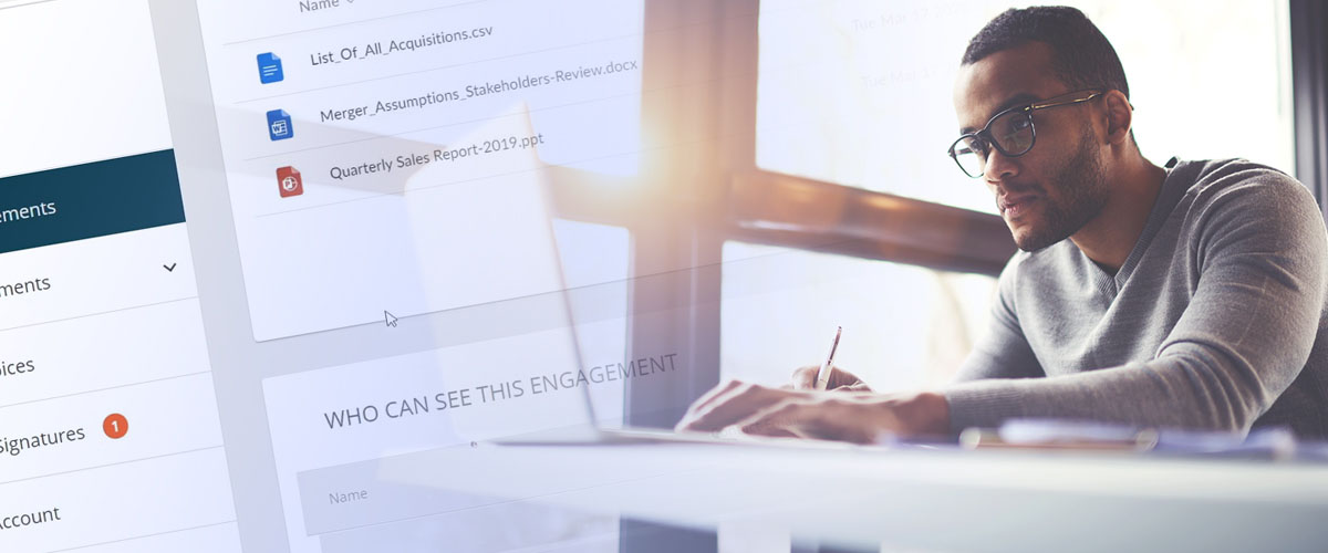 Digital composite image of businessman working on laptop with monitor at desk