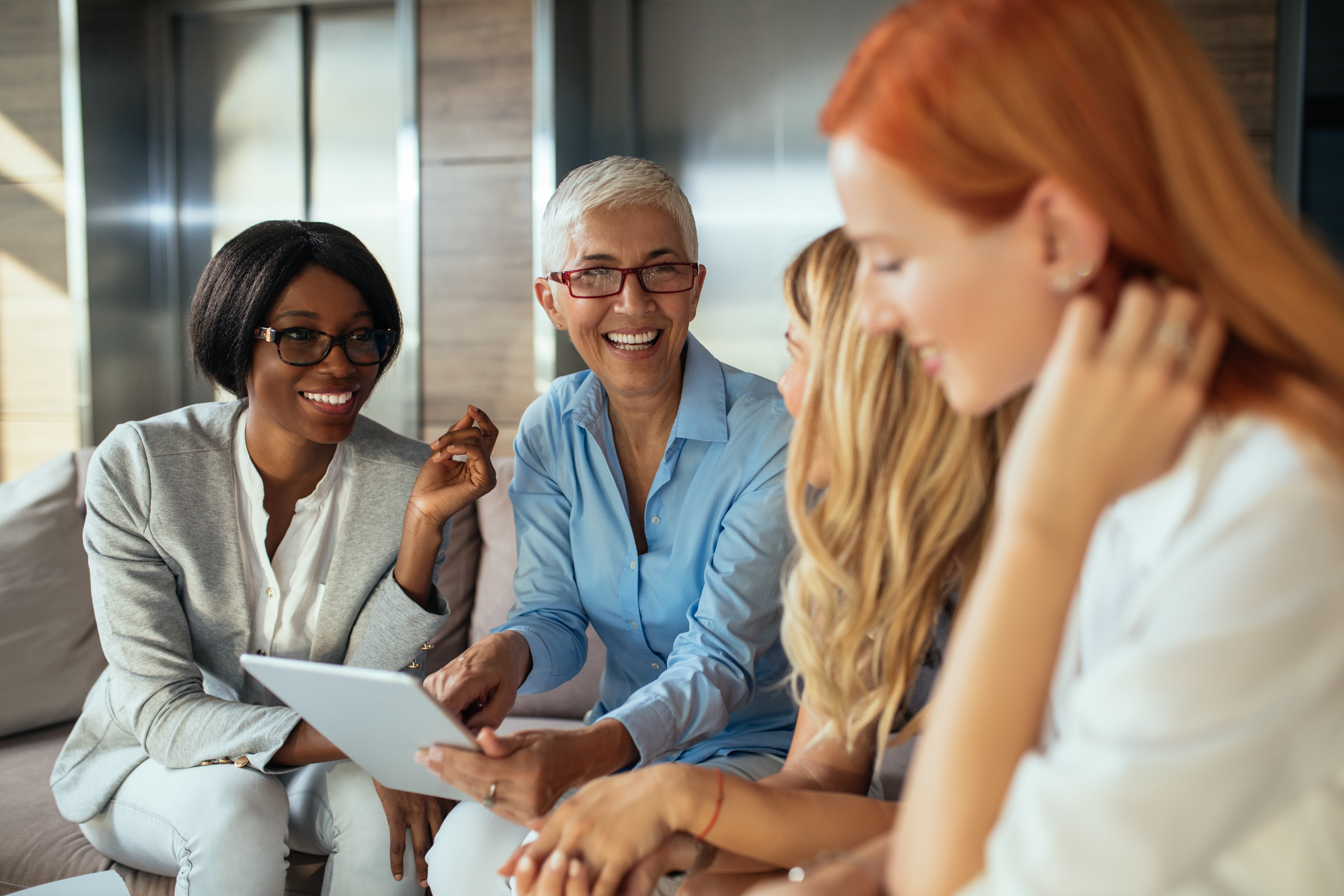 Group of business women talking.