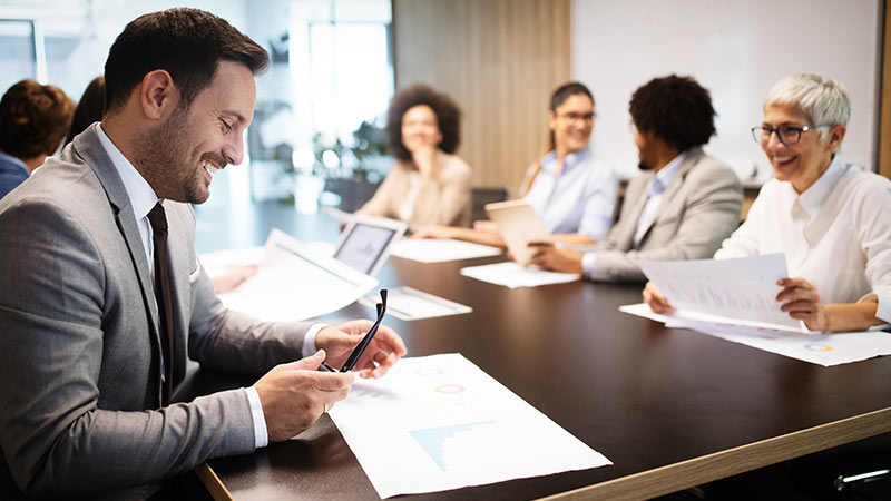 Business people sitting around a conference table